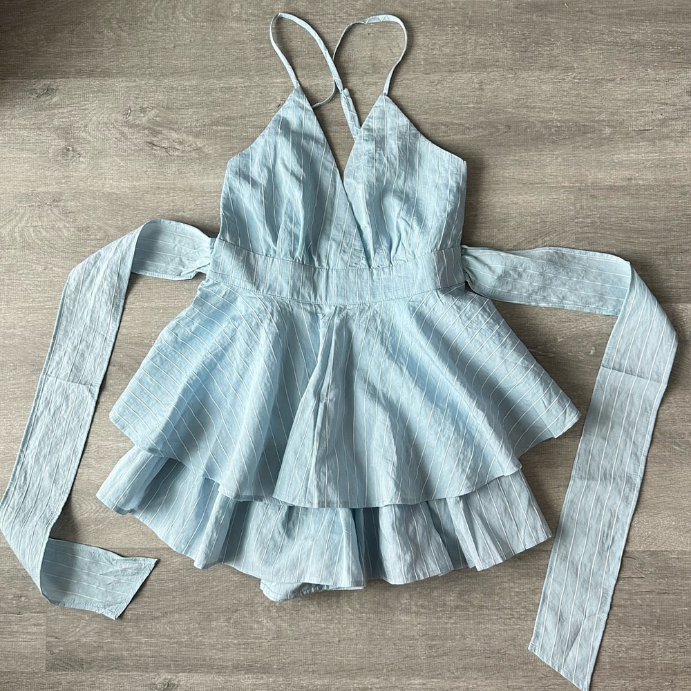 Balance Coastal Blue pinstripe ruffle romper with tie back and ruffle detail